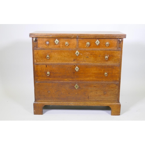 1089 - A Georgian mahogany bachelor's chest with fold over top over two plus three graduated drawers, oak l...