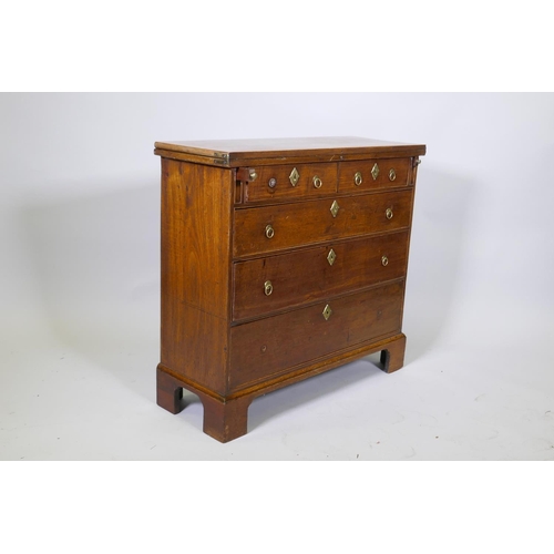 1089 - A Georgian mahogany bachelor's chest with fold over top over two plus three graduated drawers, oak l... 