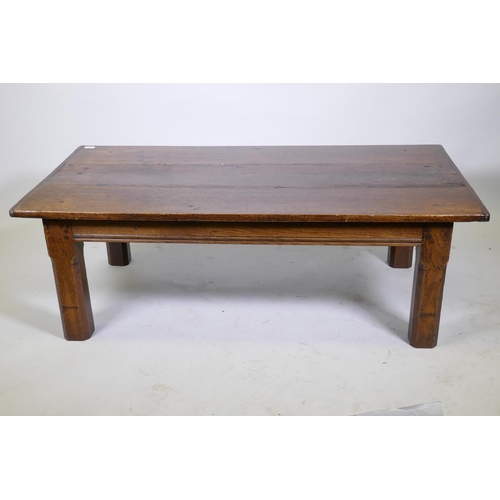 1099 - An antique oak plank top coffee table, 43 x 73cm, 49cm high