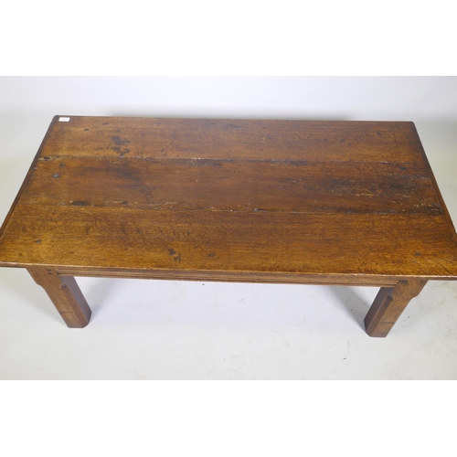 1099 - An antique oak plank top coffee table, 43 x 73cm, 49cm high