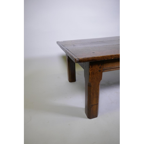 1099 - An antique oak plank top coffee table, 43 x 73cm, 49cm high