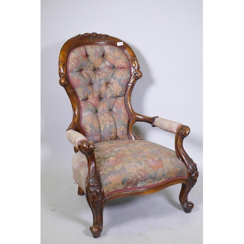 1120 - A Victorian style carved show frame walnut open armchair, with shaped back, raised on cabriole suppo... 