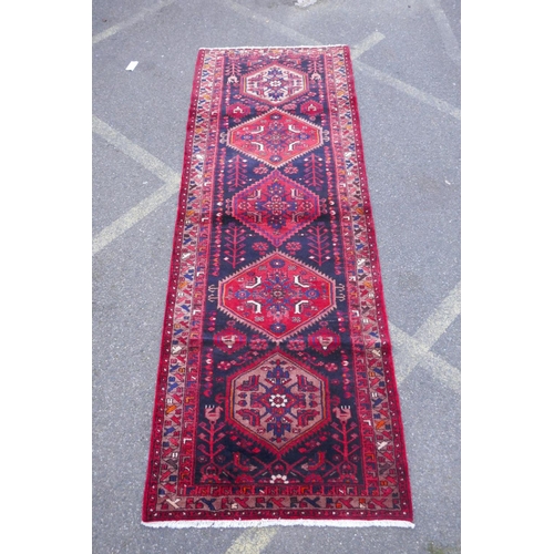 1185 - A rich ground full pile hand woven village runner from the Hamadan region, 110 x 306cm