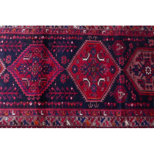 1185 - A rich ground full pile hand woven village runner from the Hamadan region, 110 x 306cm