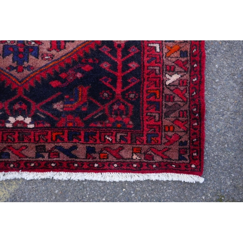 1185 - A rich ground full pile hand woven village runner from the Hamadan region, 110 x 306cm