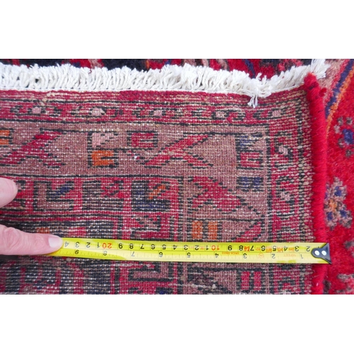 1185 - A rich ground full pile hand woven village runner from the Hamadan region, 110 x 306cm