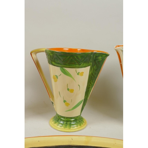 14 - Myott, Son & Co, three hand painted Art Deco style jugs and an oval plate, 39cm wide