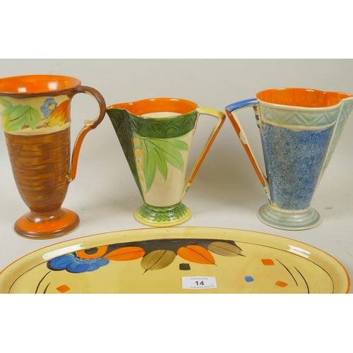 14 - Myott, Son & Co, three hand painted Art Deco style jugs and an oval plate, 39cm wide