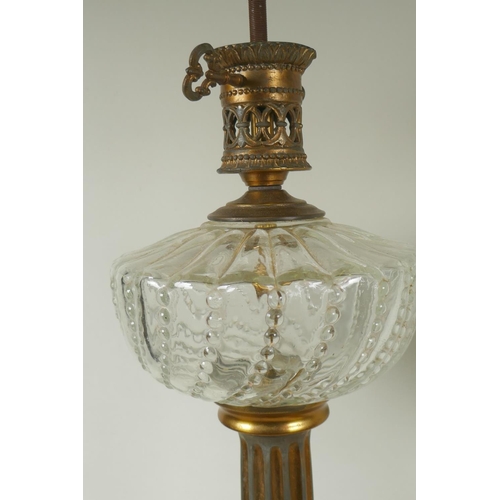 17 - Pair of gilt metal table lamps with crystal glass bowls, raised on fluted columns with marble bases,... 