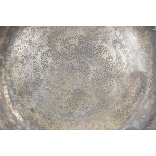 18 - An antique Ottoman low grade silver tray, with lobed rim and repousse decoration of a crescent moon,... 