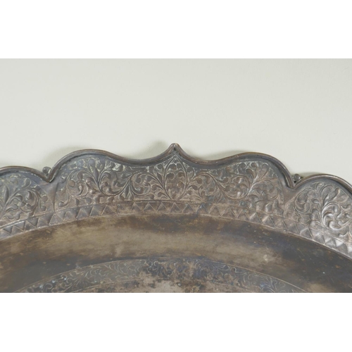 18 - An antique Ottoman low grade silver tray, with lobed rim and repousse decoration of a crescent moon,... 