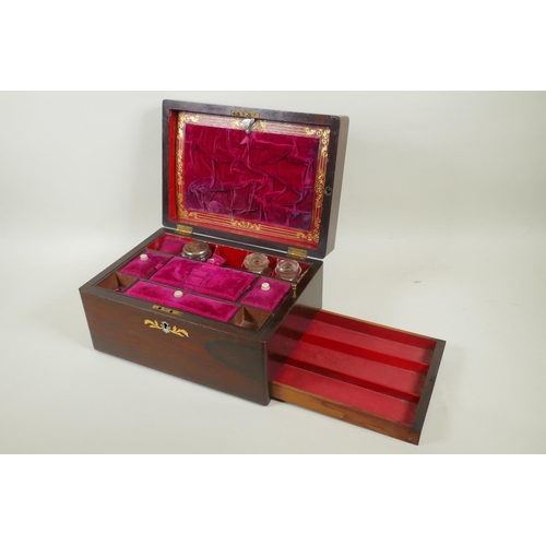 21 - A Victorian rosewood vanity box with brass, mother of pearl and abalone inlaid decoration, fitted in... 