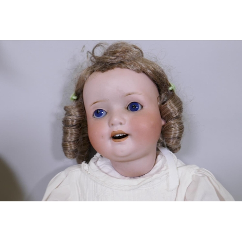 25 - An antique Heubach Koppelsdorf porcelain head doll with rolling eyes, No 300.3, 57cm high, and anoth... 