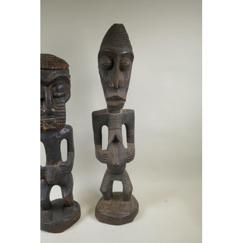 251 - An African tribal carved wood figure of a bearded man, and another similar of a woman, largest 68cm ... 