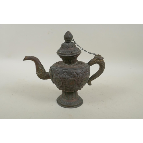 258 - A Tibetan copper and brass repousse tea pot with phoenix head handle and dragon head spout, 21cm hig... 