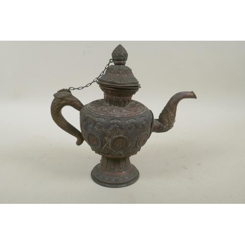 258 - A Tibetan copper and brass repousse tea pot with phoenix head handle and dragon head spout, 21cm hig... 