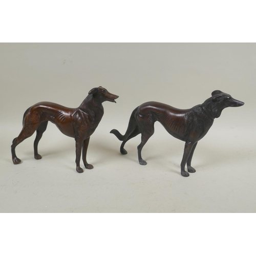 261 - A pair of bronze hounds, 27cm long