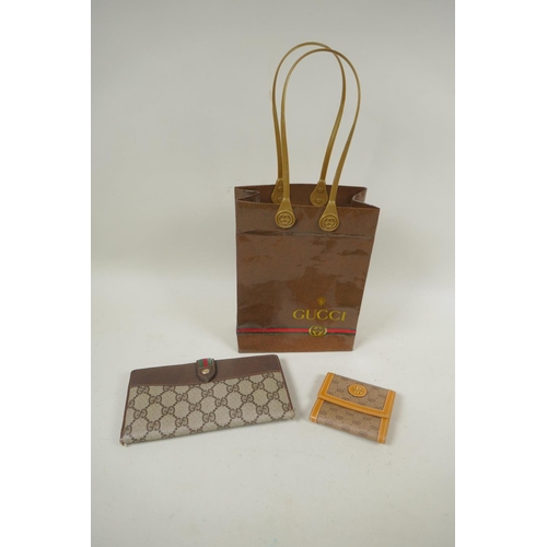 263 - A Gucci Anniversary Collection wallet, No. 64.03.110, and a smaller Gucci sample purse, marked Sampl... 