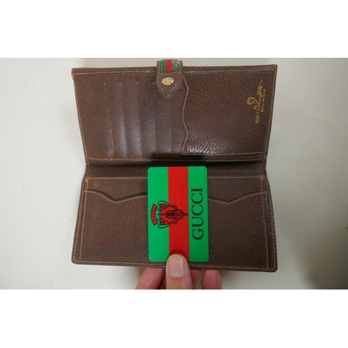 263 - A Gucci Anniversary Collection wallet, No. 64.03.110, and a smaller Gucci sample purse, marked Sampl... 