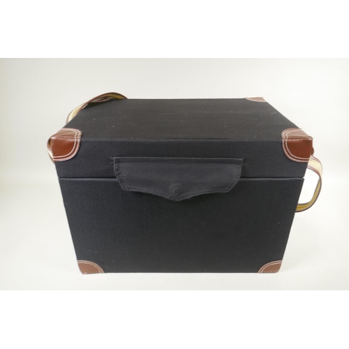 269 - A canvas covered picnic box, fitted with contents for four settings, 44 x 28cm, 32cm high