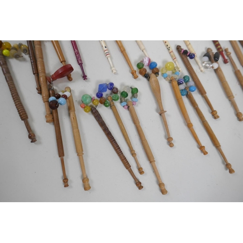 28 - Collection of antique bone and wood lace maker's bobbins, largest 12cm long