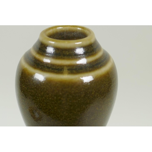 33 - A Chinese tea glazed vase, 27cm high