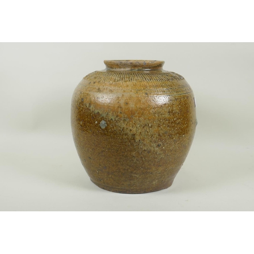 35 - An oriental green glazed stoneware pot, 26cm high