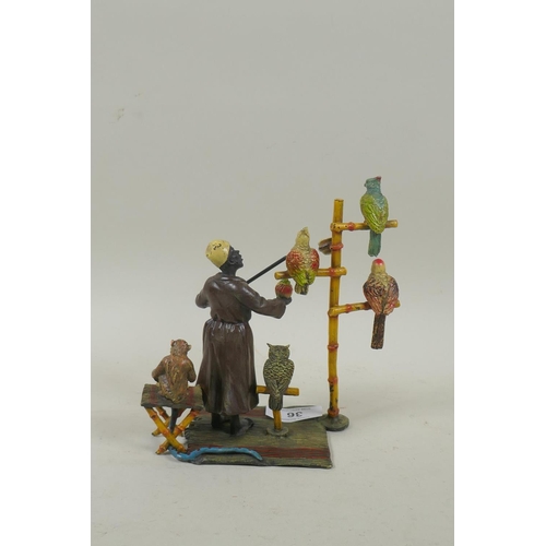 36 - Cold painted bronze figure of a bird seller with accompanying monkey, in the manner of Bergman, mark... 