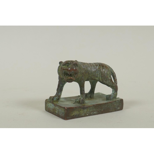 40 - Chinese copper seal in the form of a prowling tiger, 6cm long, 4.5cm high