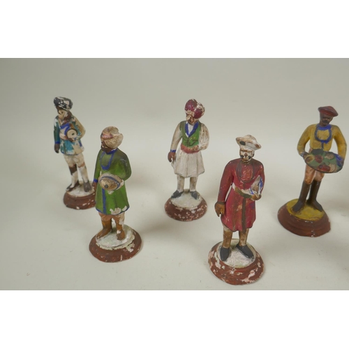 41 - A collection of twelve Indian painted plaster figures of tradespeople, AF, 17cm high