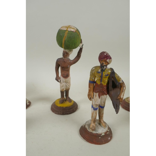 41 - A collection of twelve Indian painted plaster figures of tradespeople, AF, 17cm high