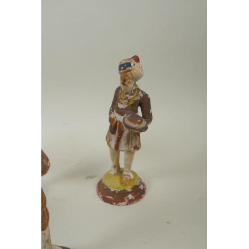 41 - A collection of twelve Indian painted plaster figures of tradespeople, AF, 17cm high