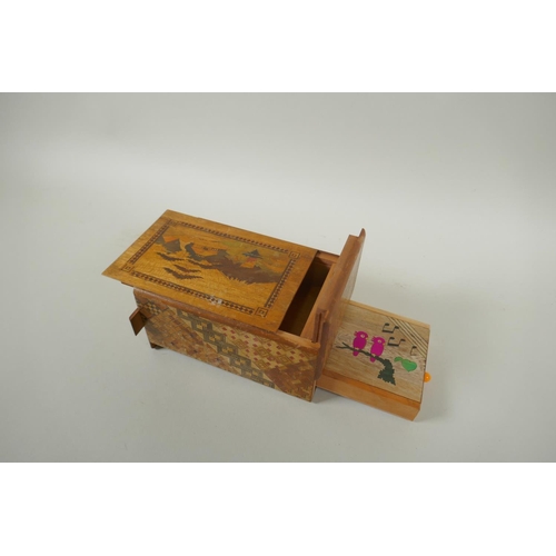 46 - A Japanese Yosegi-Zaiku marquetry puzzle box, opening to reveal a secret musical drawer, 15 x 10cm