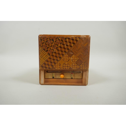 46 - A Japanese Yosegi-Zaiku marquetry puzzle box, opening to reveal a secret musical drawer, 15 x 10cm