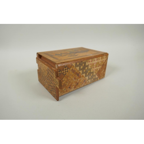 46 - A Japanese Yosegi-Zaiku marquetry puzzle box, opening to reveal a secret musical drawer, 15 x 10cm