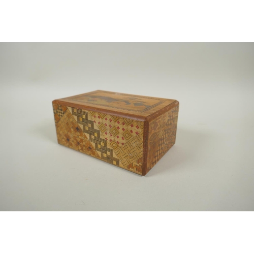 46 - A Japanese Yosegi-Zaiku marquetry puzzle box, opening to reveal a secret musical drawer, 15 x 10cm