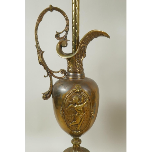 52 - Pair of brass ewer shaped table lamps with raised putti decoration, 74cm high