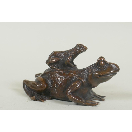 59 - Oriental bronze  figure of a toad riding on the back of another