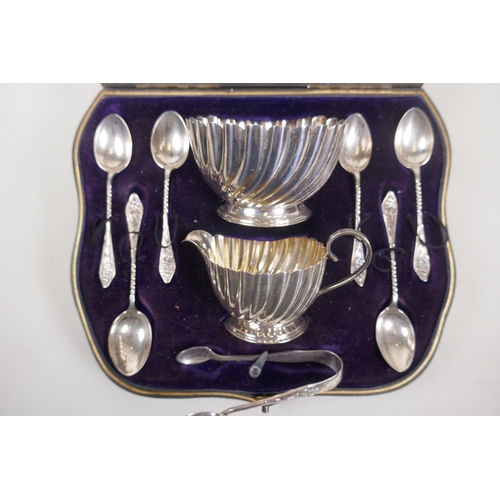 602 - An Edwardian silver tea set of cream, jug and sugar bowl, spoons and tongs, Birmingham 1906, maker's... 