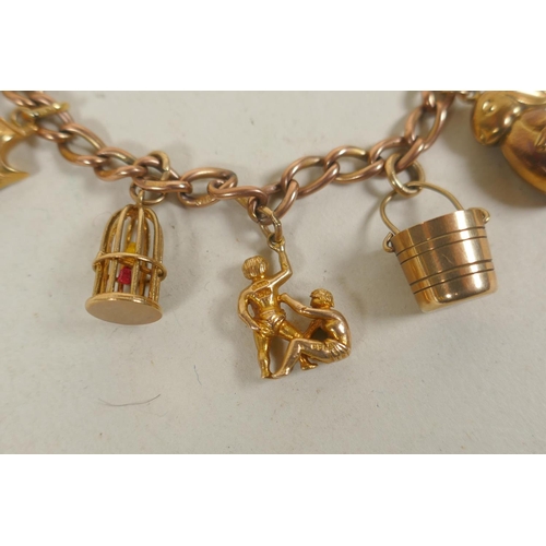 610 - 9ct gold charm bracelet, 26.4g