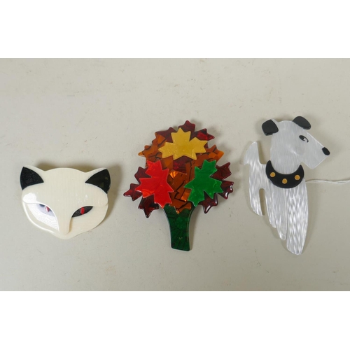 615 - Lea Stein of Paris, three plastic brooches, a cat, a dog and a tree, largest 9cm