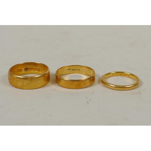 619 - Two 22ct gold wedding bands, size K and Q, 10.5g gross, and one 18ct gold wedding band, size Q, 3.4g