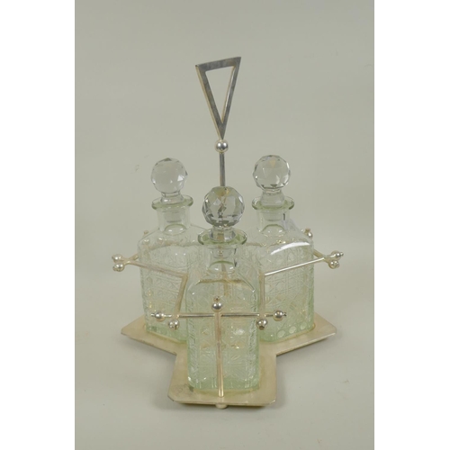 621 - Christopher Dresser style silver plated three section decanter stand with crystal glass decanters, 3... 