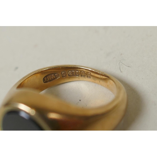 622 - 9ct gold signet ring set with jet and a small diamond, size J/K, 8.5g