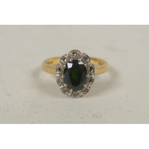 629 - 18ct gold ring set with diamonds and a central green gem stone, size M, 4.7g