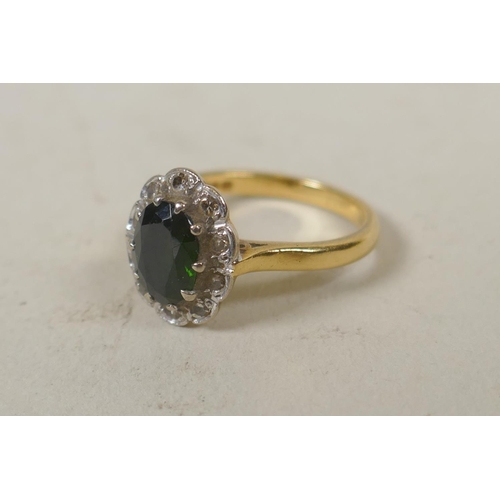 629 - 18ct gold ring set with diamonds and a central green gem stone, size M, 4.7g