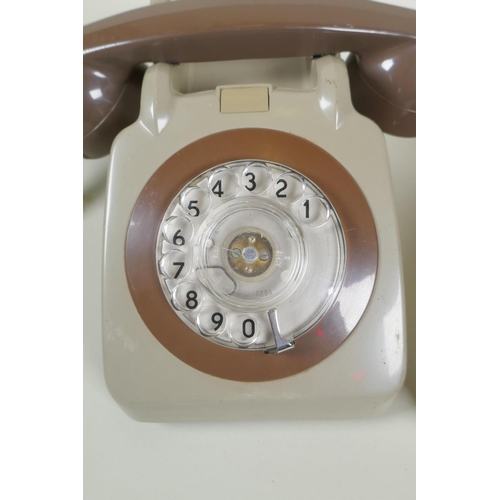 63 - A pair of vintage rotary dial telephones