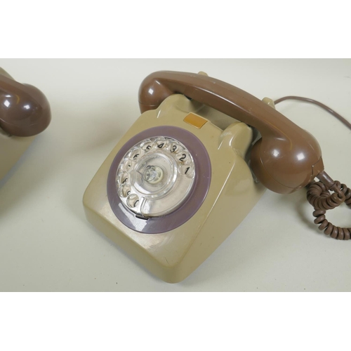 63 - A pair of vintage rotary dial telephones