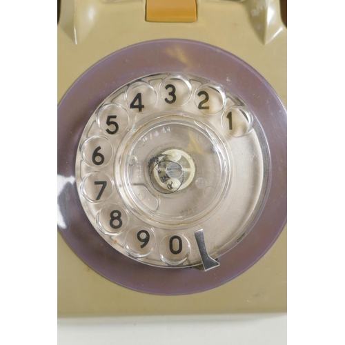 63 - A pair of vintage rotary dial telephones