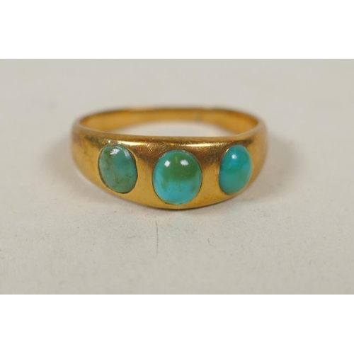 633 - 18ct gold ring set with three turquoise stones, size M, 3.8g, and a 9ct gold dress ring set with a g... 